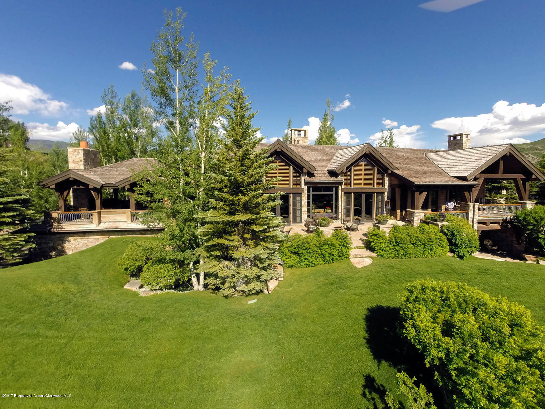 770 Pioneer Springs Ranch Road Aspen, CO 81611 - Photo 45 of 46 a front view of a house with garden