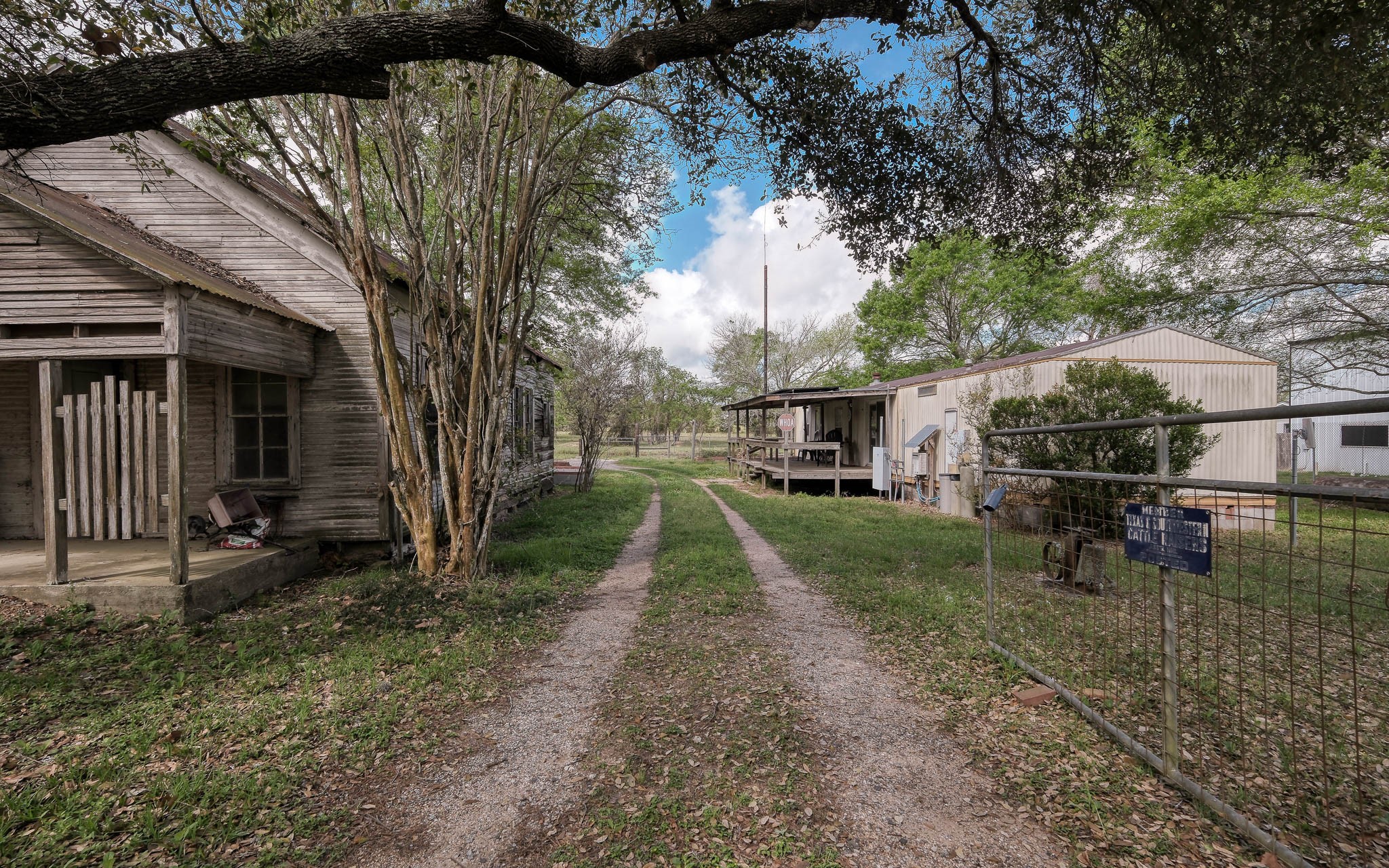 25945 Kickapoo Road Hockley, TX 77447 - Photo 3 of 35 Driveway gate with gravel driveway