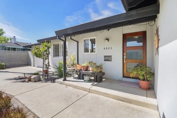 a outdoor living space with furniture and flowers