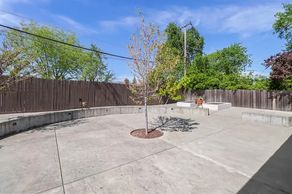 a front view of house with yard and outdoor seating