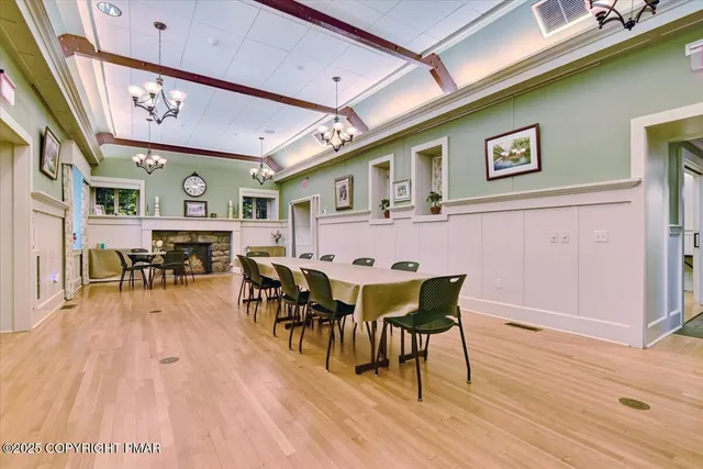 a view of a dining area with furniture and wooden floor