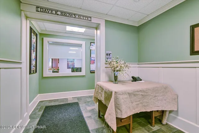a dining room with a table and chairs