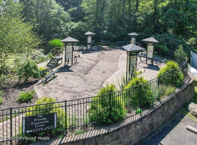 a bathroom with a sink toilet and a mirror