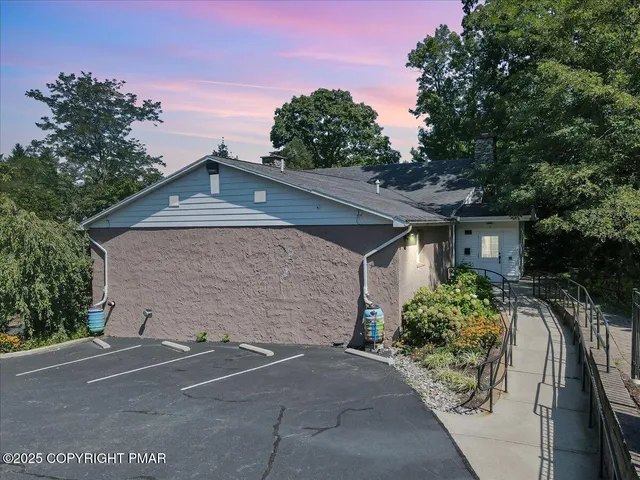 a house with trees in the background