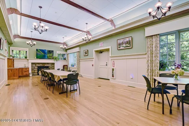a view of a dining room with furniture window and wooden floor