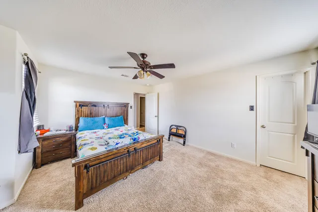 a bedroom with furniture and a bed