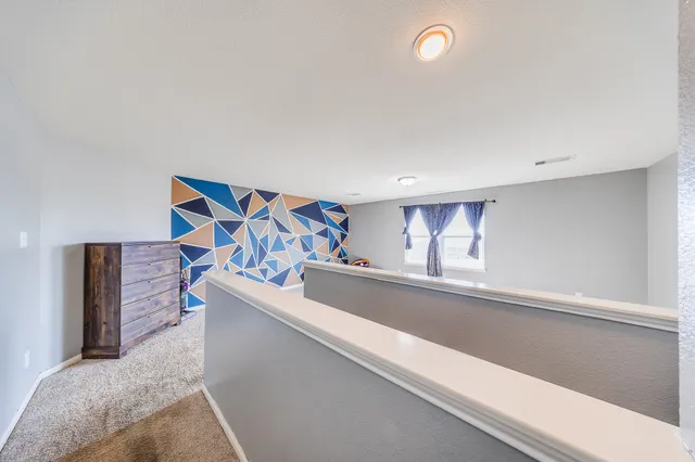 a view of livingroom with furniture and workspace