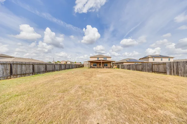 a view of swimming pool with a yard