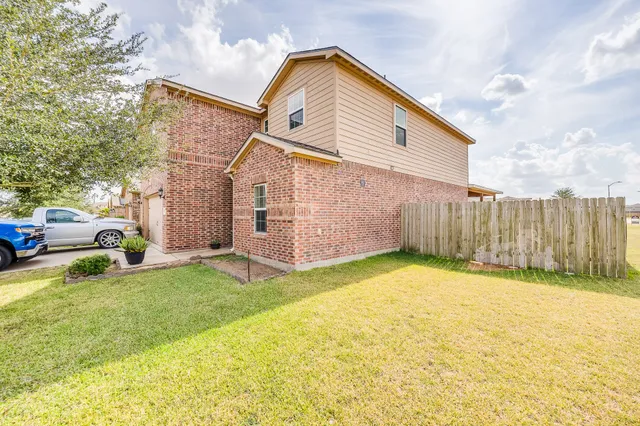 a view of a backyard of the house