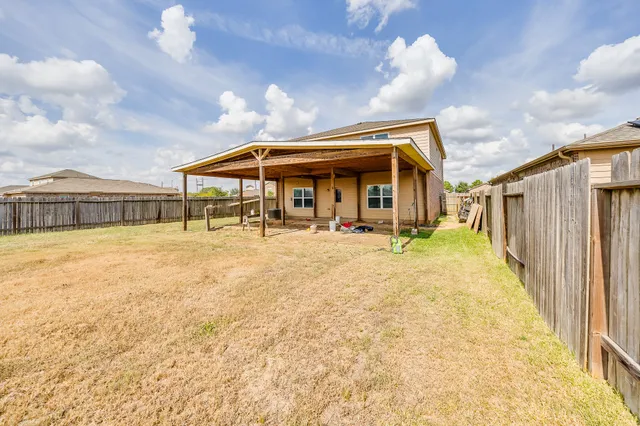 a view of a house with wooden floor and roof