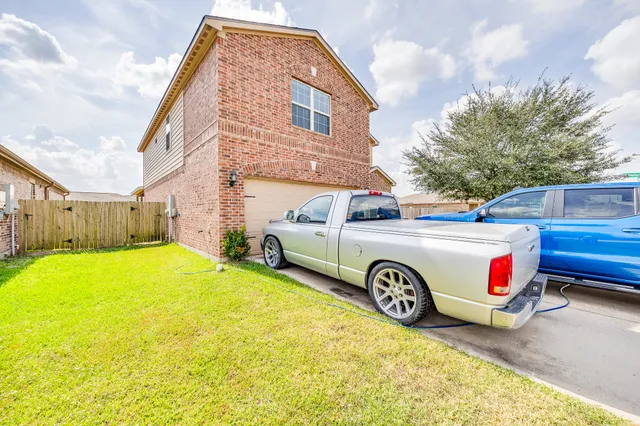 a view of a car in front of a house