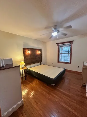 a living room with pool table and a flat screen tv