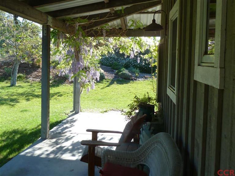 7527 Old Careaga Ranch Road Santa Maria, CA 93455 - Photo 7 of 22 a view of a porch with furniture and a garden