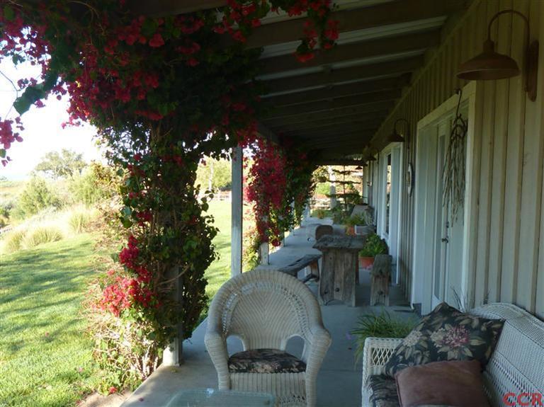 7527 Old Careaga Ranch Road Santa Maria, CA 93455 - Photo 8 of 22 a view of a porch with furniture and a yard