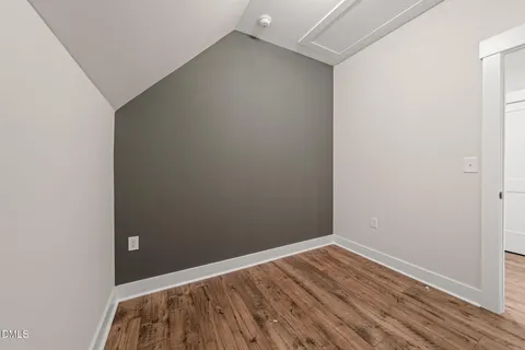 a view of room with wooden floor