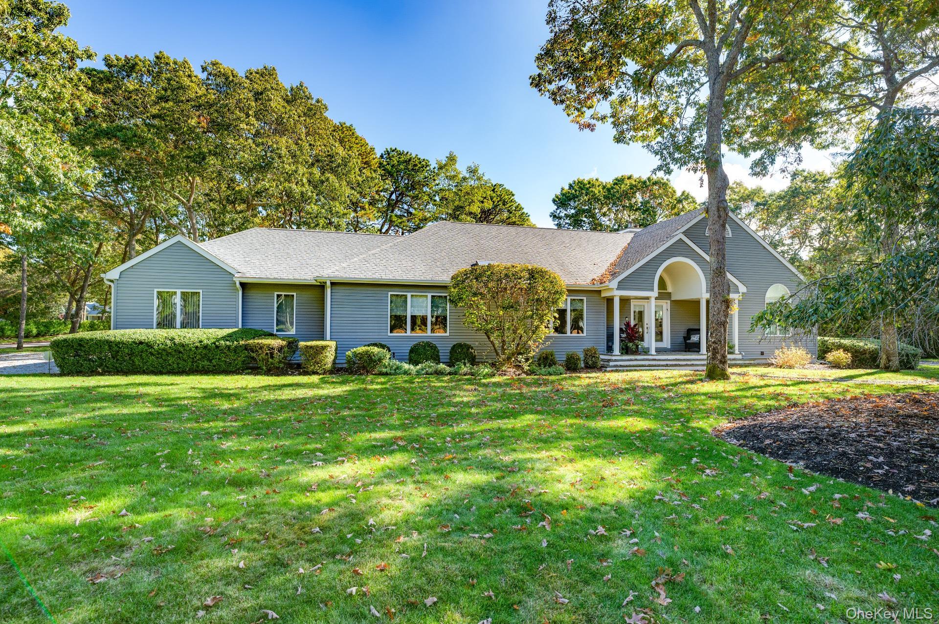 6 Bridle Path Westhampton Beach, NY 11978 - Photo 2 of 33 a front view of house with yard and green space