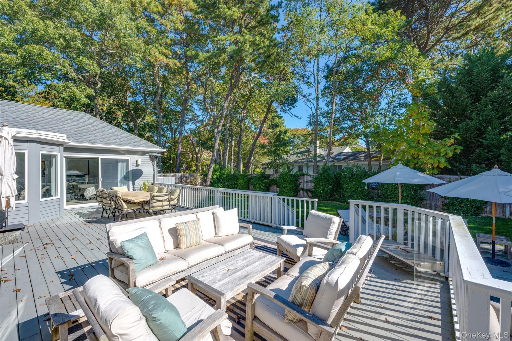 6 Bridle Path Westhampton Beach, NY 11978 - Photo 23 of 33 a view of balcony with wooden floor and outdoor seating