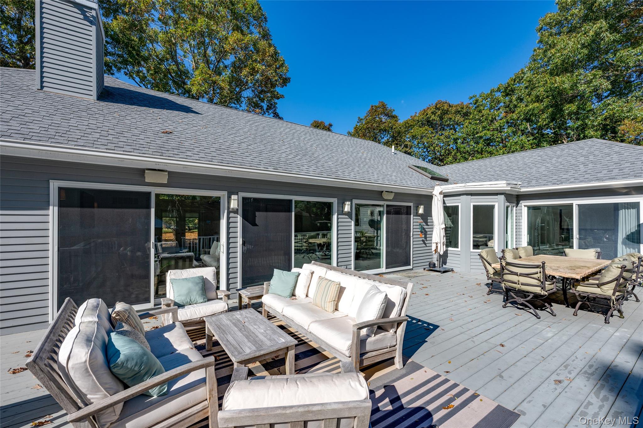 6 Bridle Path Westhampton Beach, NY 11978 - Photo 26 of 33 a view of a patio with couple of chairs and a table