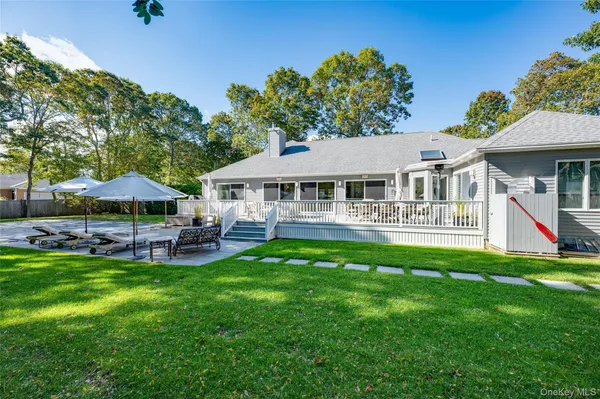 a view of a house with a yard porch and sitting area