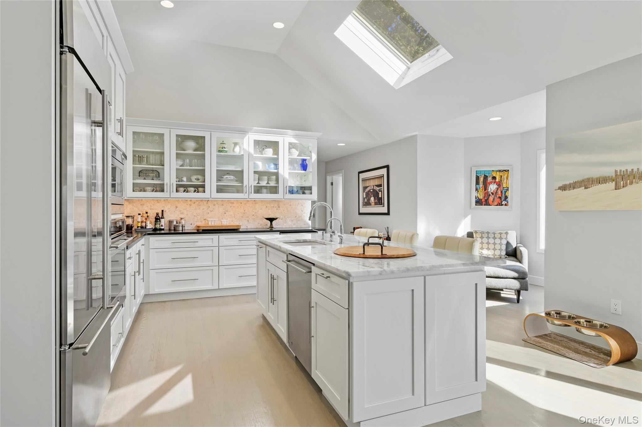 6 Bridle Path Westhampton Beach, NY 11978 - Photo 8 of 33 a kitchen with a sink stove and cabinets