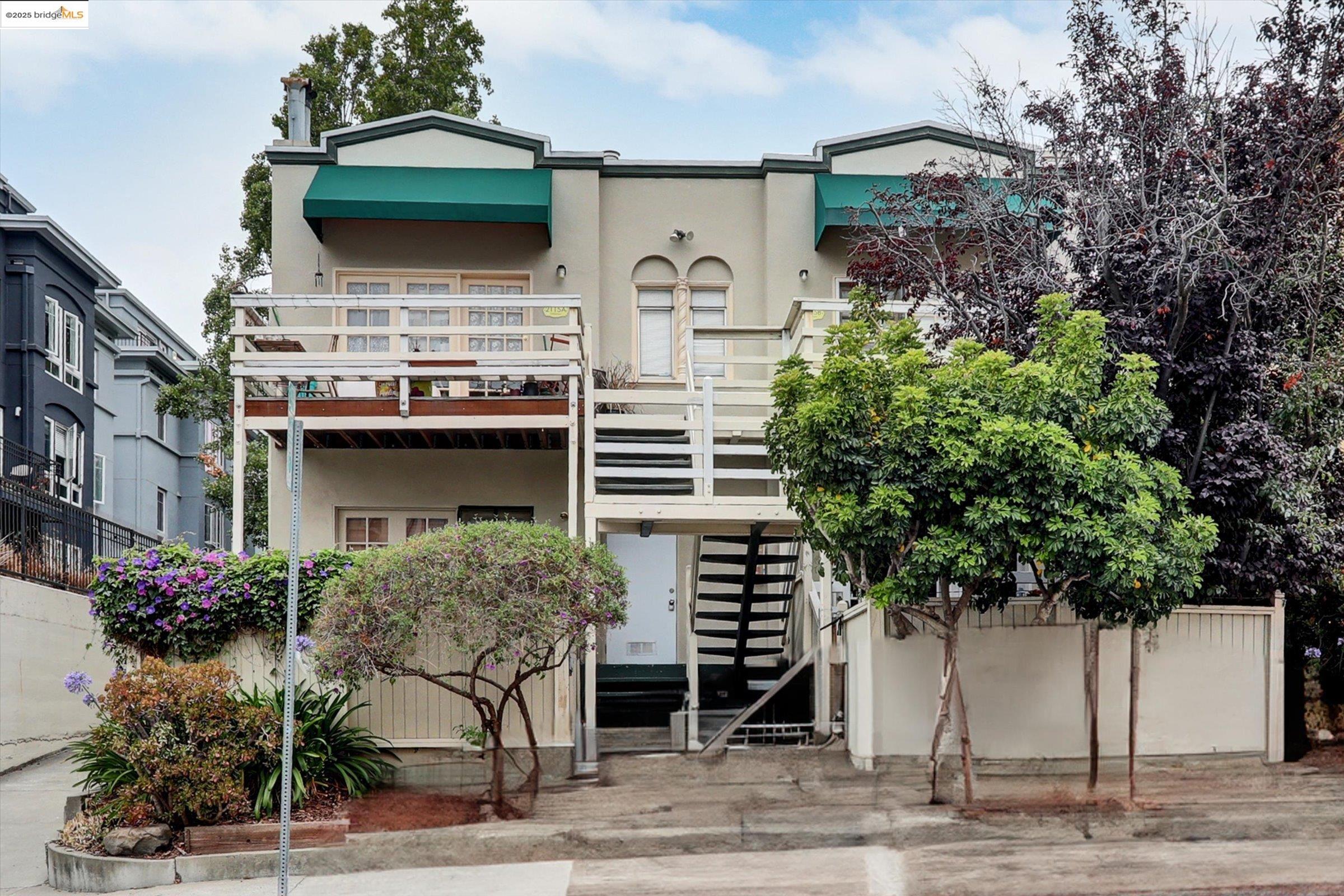 2117 Delaware Street, Unit B Berkeley, CA 94709 - Photo 1 of 14 a front view of a house with garden