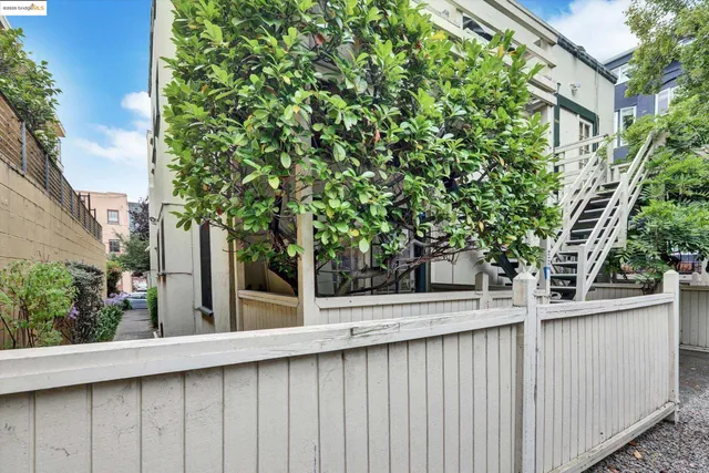 a view of a house with a tree