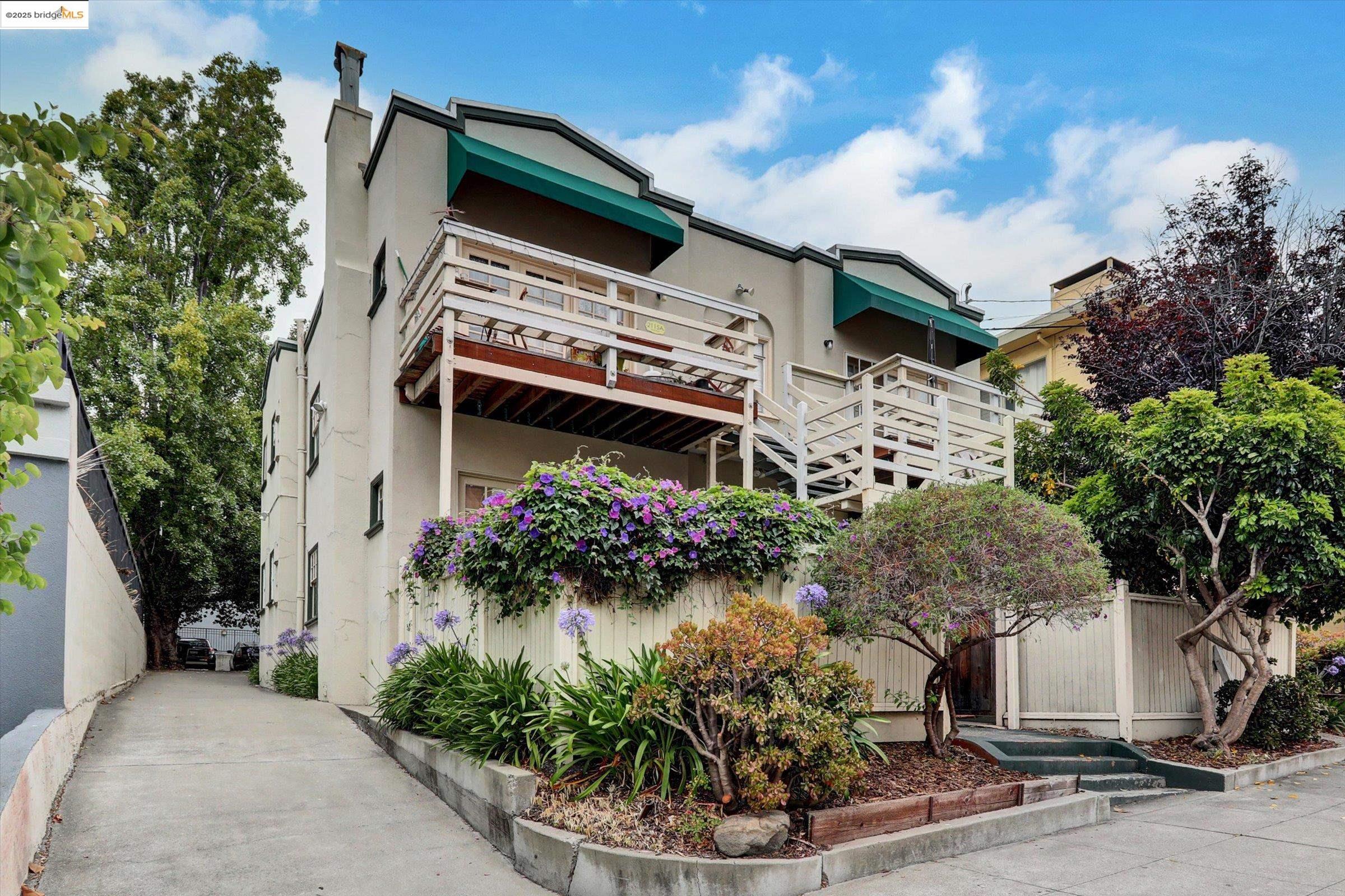 2117 Delaware Street, Unit B Berkeley, CA 94709 - Photo 14 of 14 a front view of a house with a garden