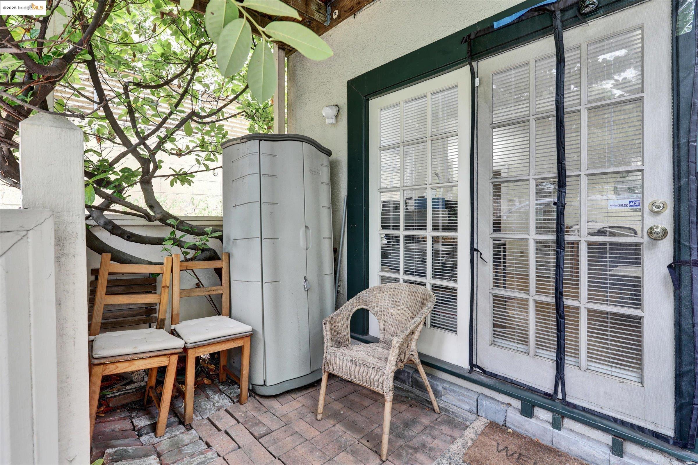 2117 Delaware Street, Unit B Berkeley, CA 94709 - Photo 9 of 14 a balcony with table and chairs
