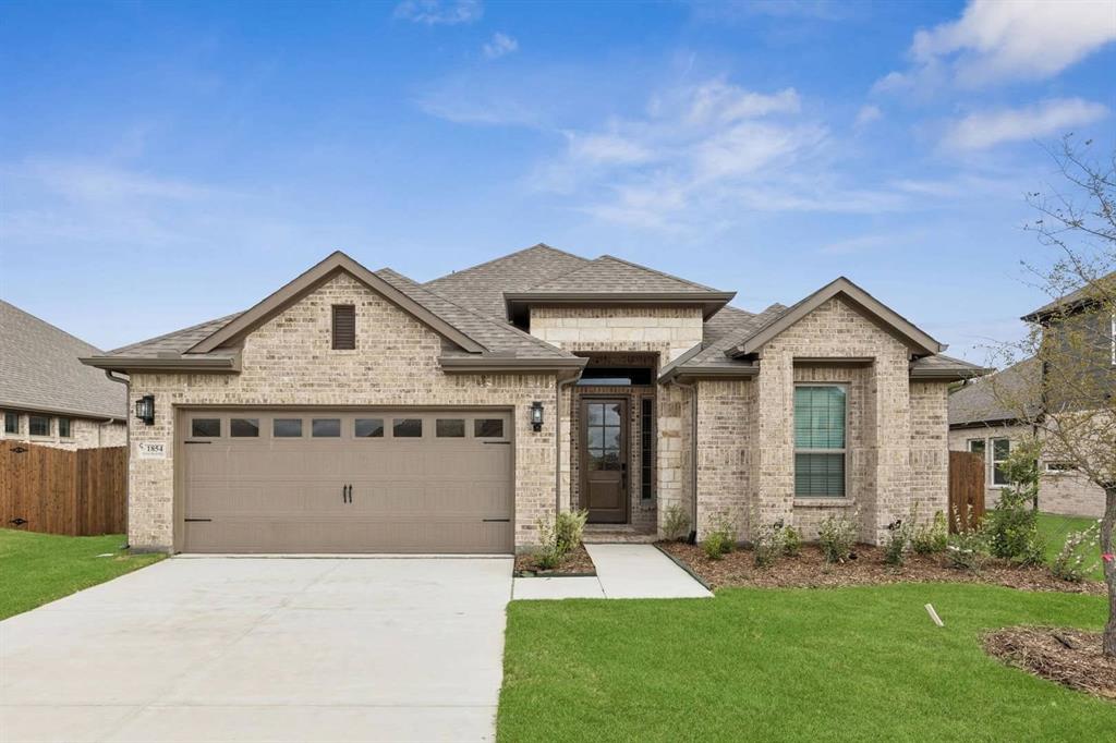1854 Silver Birch Road Waxahachie, TX 75165 - Photo 1 of 1 a front view of a house with a yard and garage
