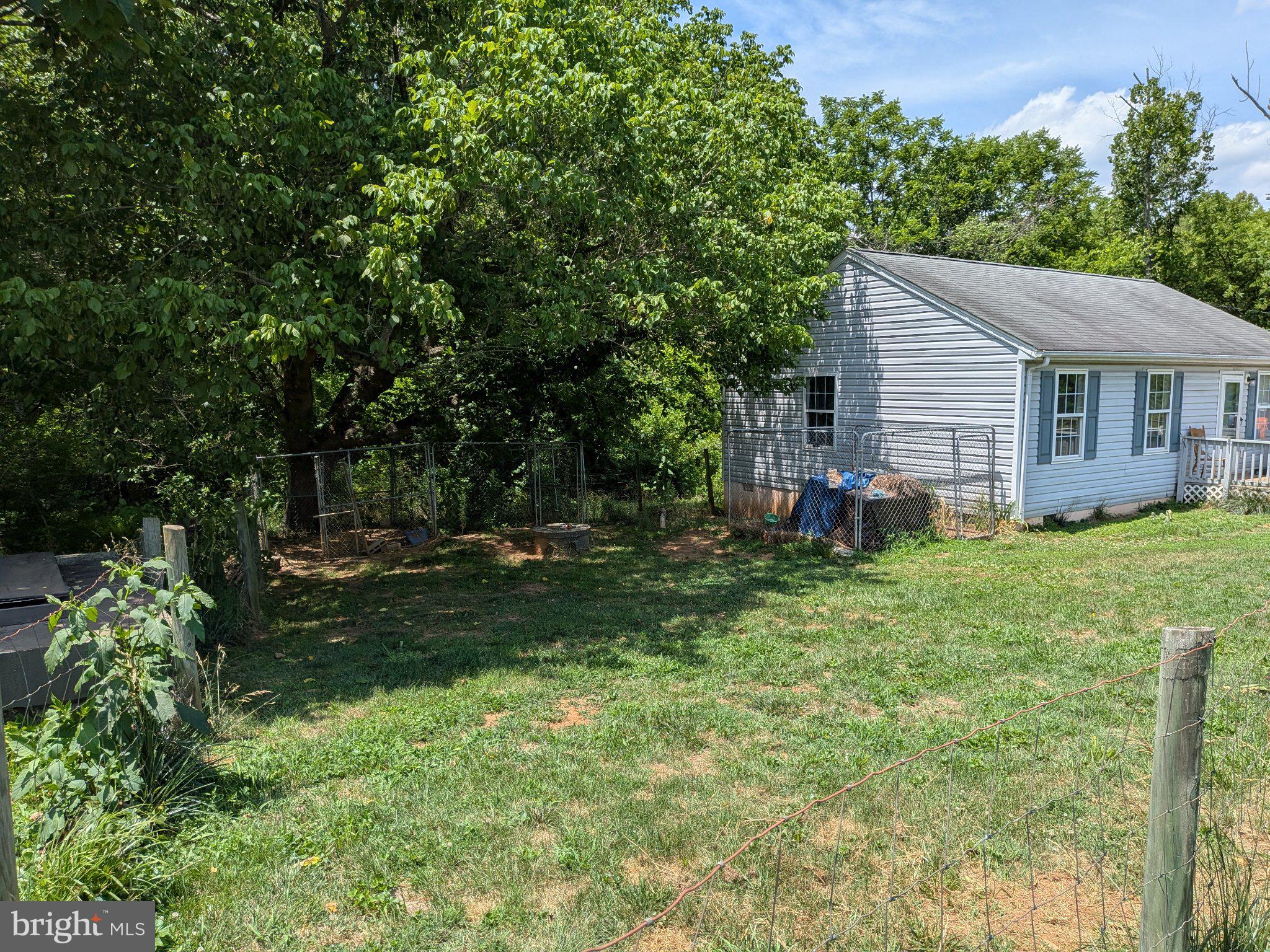 10198 Old Rapidan Road Orange, VA 22960 - Photo 2 of 29 Charming home with lush greenery.