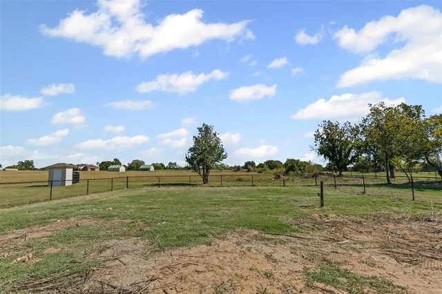 a view of a golf course with a lake