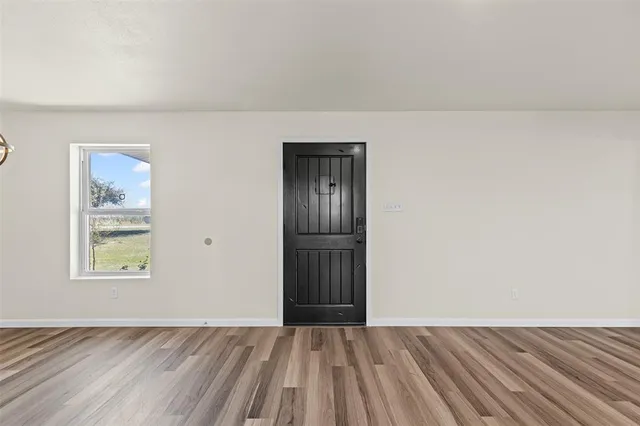 a view of an empty room and window