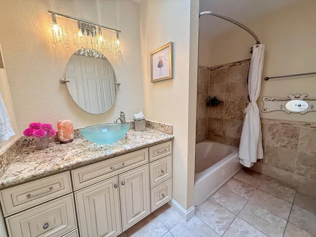 a view of a livingroom with furniture wooden floor and a fireplace