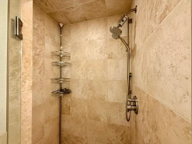 a living room with furniture a dining table and a window