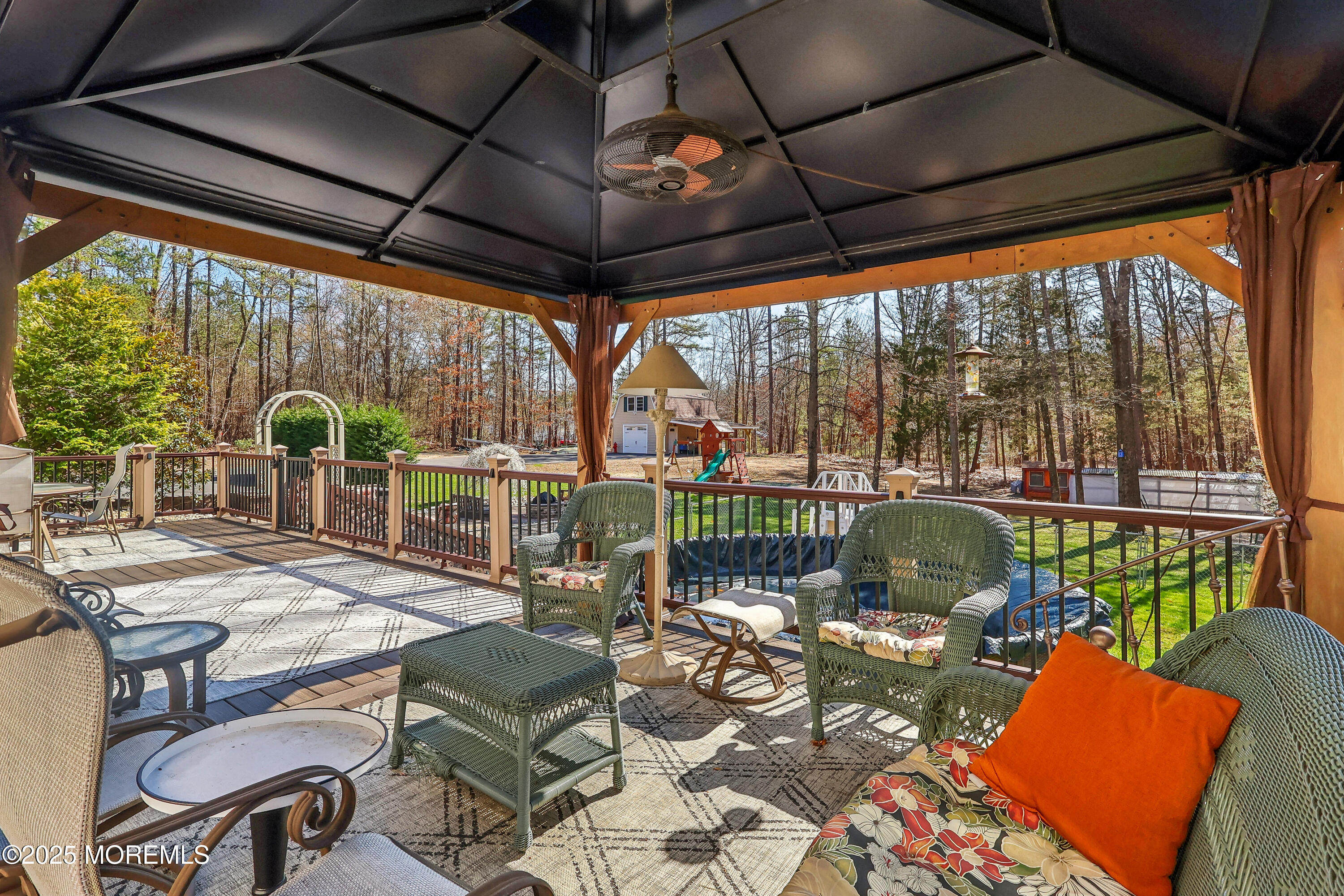 6 Meirs Road Cream Ridge, NJ 08514 - Photo 20 of 62 a view of a patio with couches table and chairs and potted plants