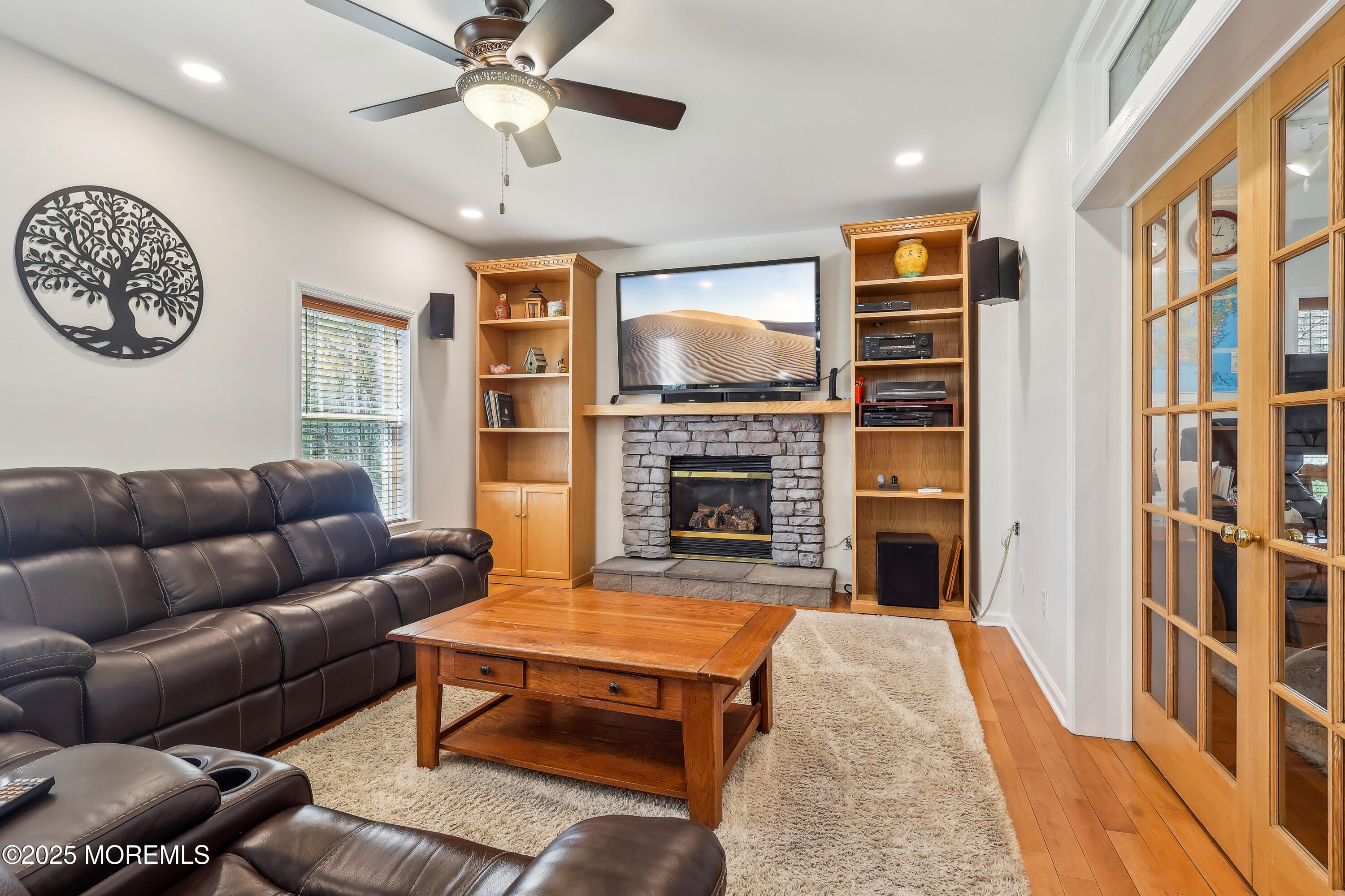 6 Meirs Road Cream Ridge, NJ 08514 - Photo 33 of 62 a living room with furniture a flat screen tv and a fireplace