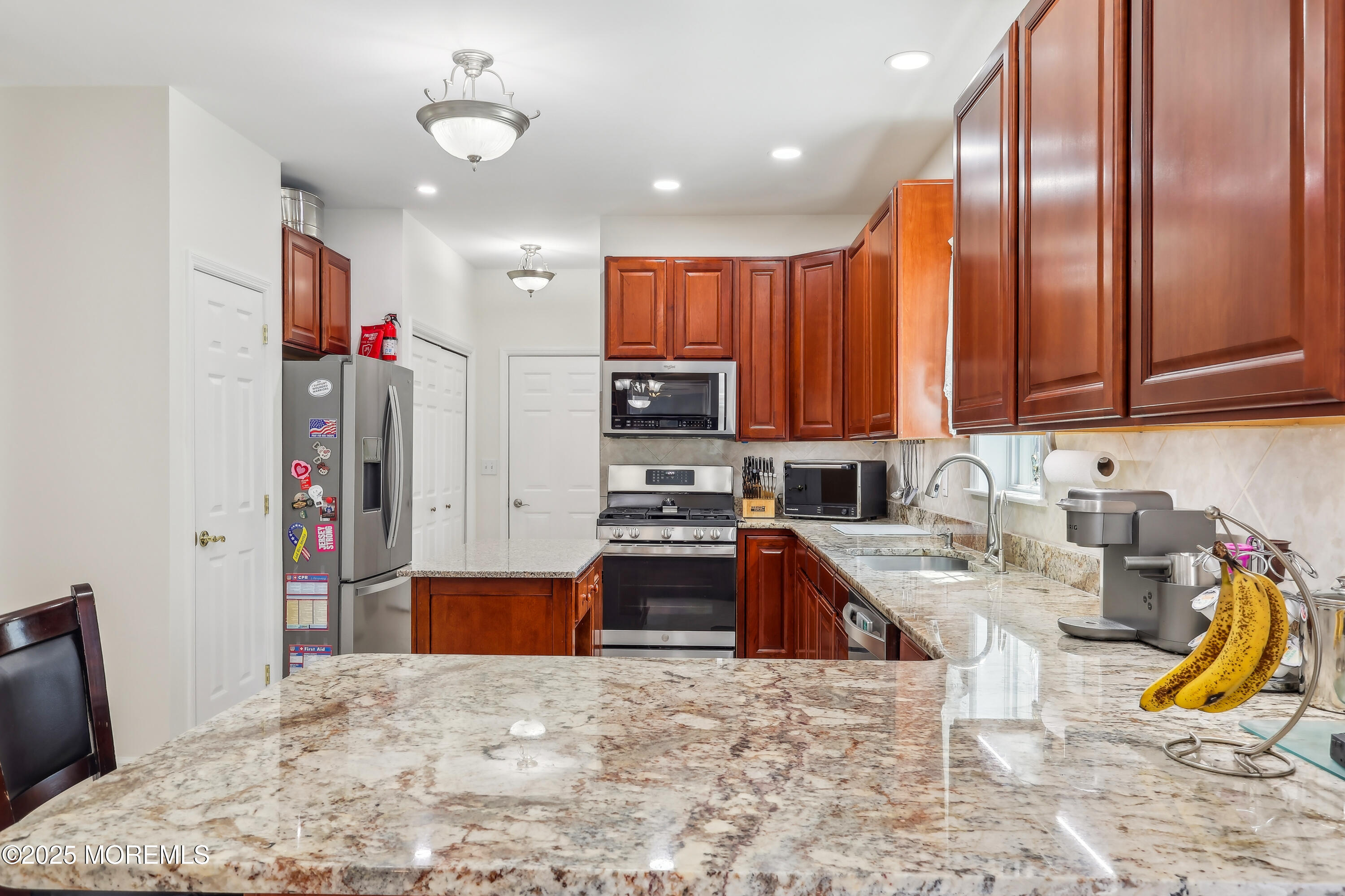 6 Meirs Road Cream Ridge, NJ 08514 - Photo 39 of 62 a kitchen with stainless steel appliances granite countertop a refrigerator stove top oven and sink