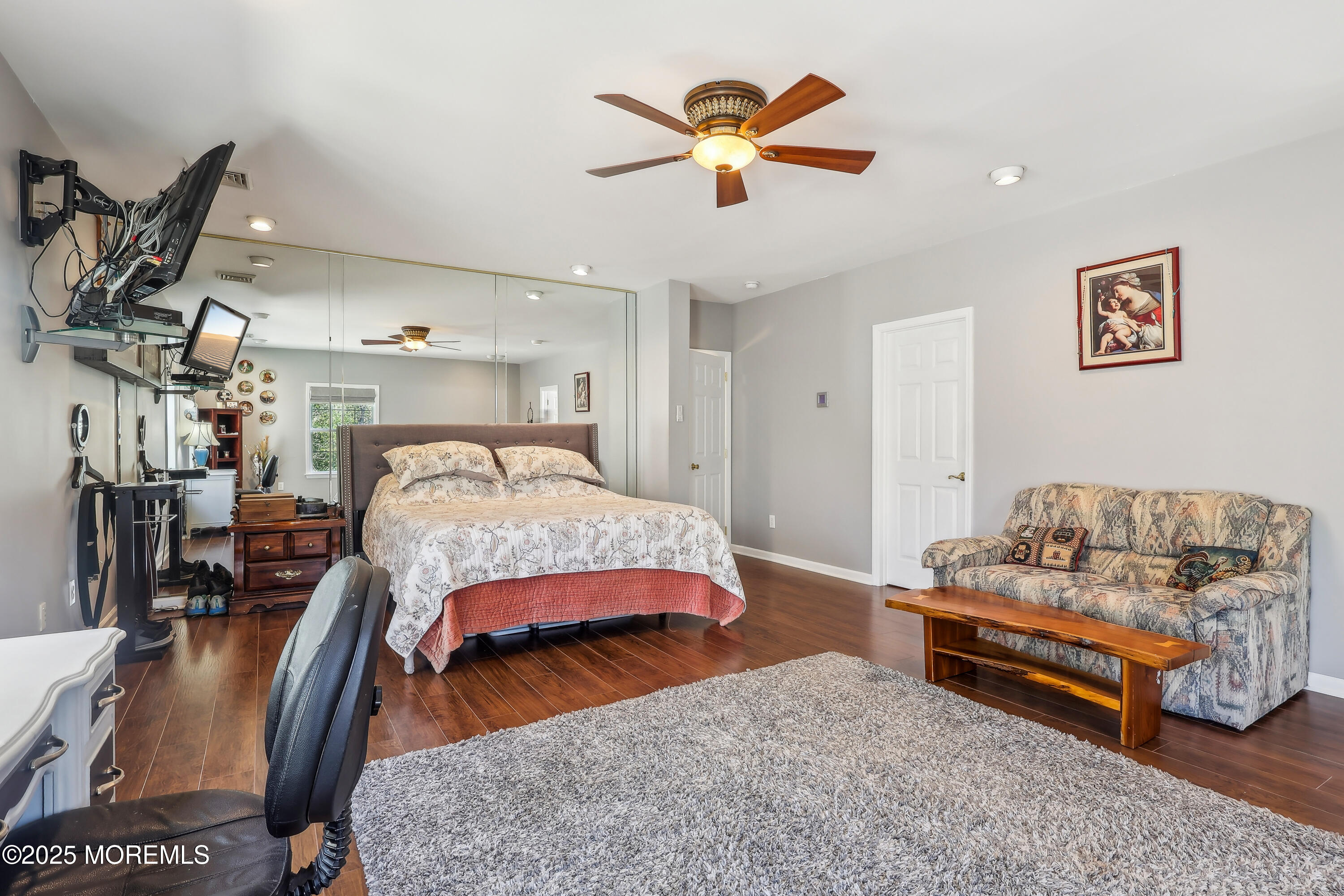 6 Meirs Road Cream Ridge, NJ 08514 - Photo 42 of 62 a bedroom with a bed a couch and a chandelier
