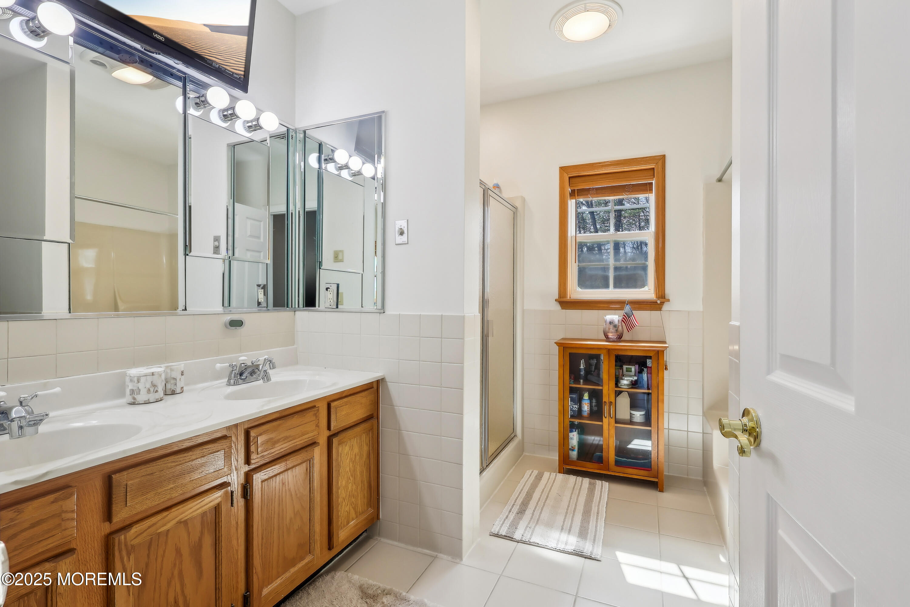 6 Meirs Road Cream Ridge, NJ 08514 - Photo 46 of 62 a spacious bathroom with a shower a sink and a mirror