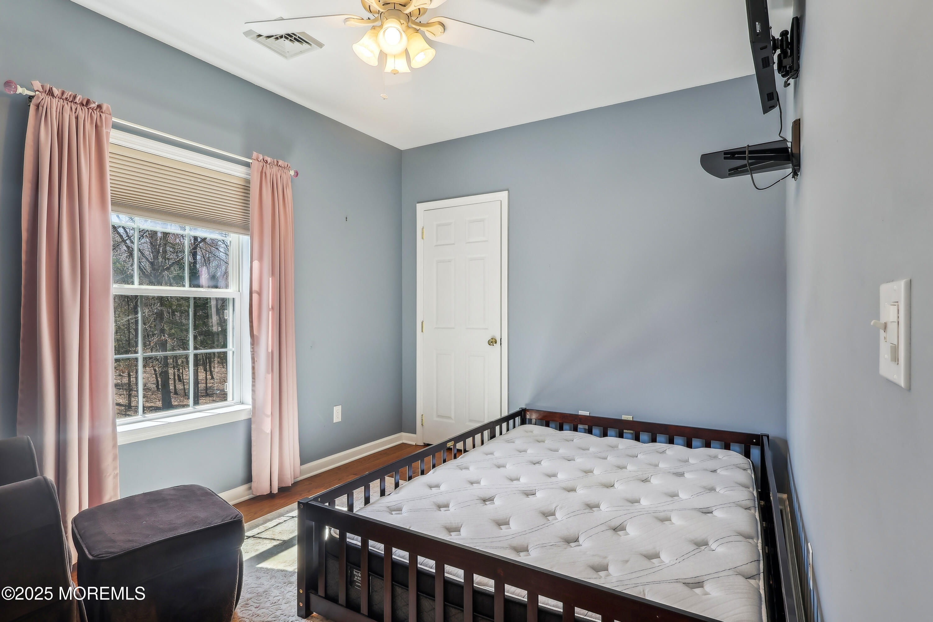 6 Meirs Road Cream Ridge, NJ 08514 - Photo 50 of 62 a bedroom with a bed and wooden floor