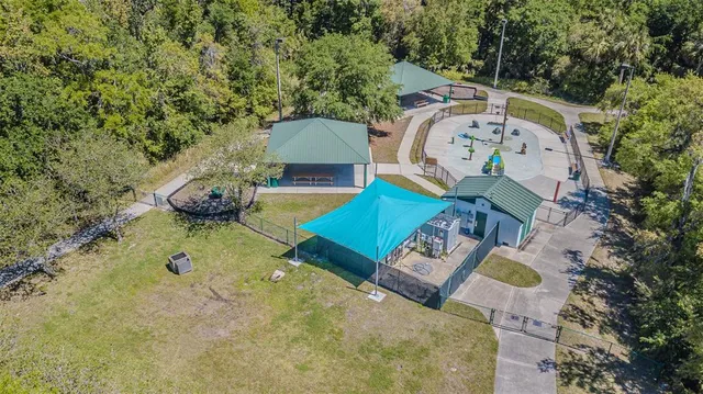 an aerial view of a house with outdoor space