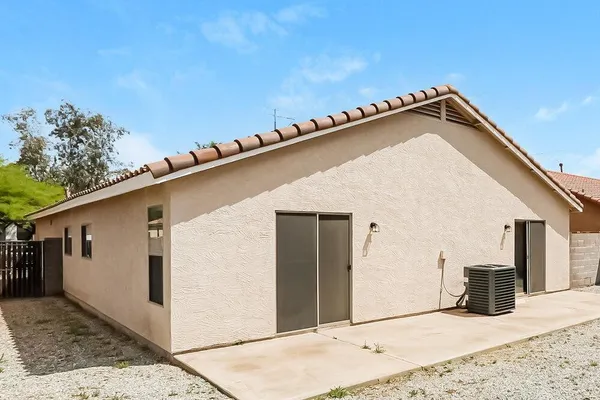 a view of a house with a backyard space