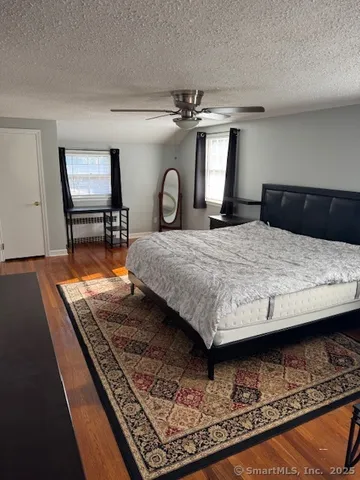 a bedroom with a bed and dresser