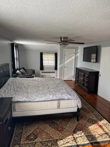 a living room with fireplace furniture and a flat screen tv