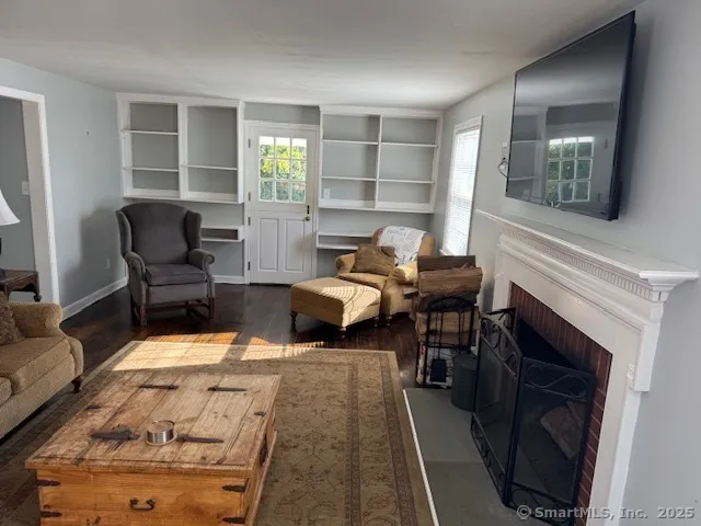 a room with furniture and a fireplace