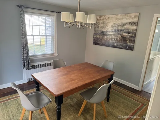 a dining room with a table and chairs