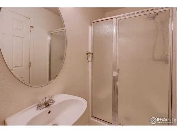 a bathroom with a sink vanity and a mirror