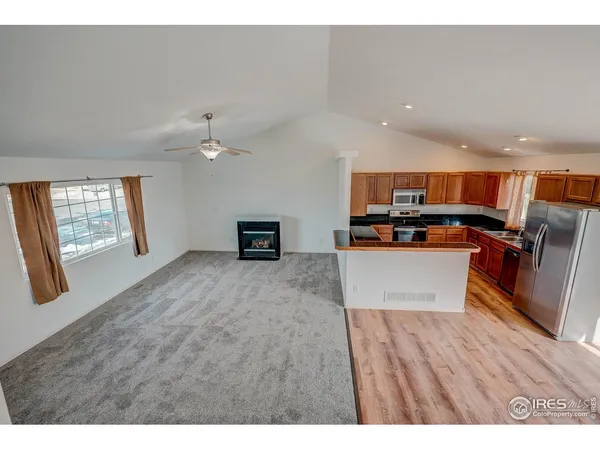 a view of kitchen with wooden floor