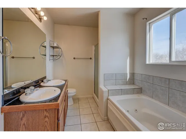 a bathroom with a sink a bathtub and a mirror