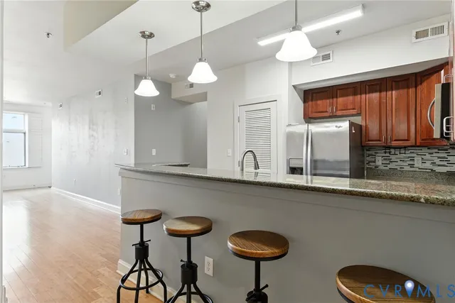 a kitchen with a table and chairs in it